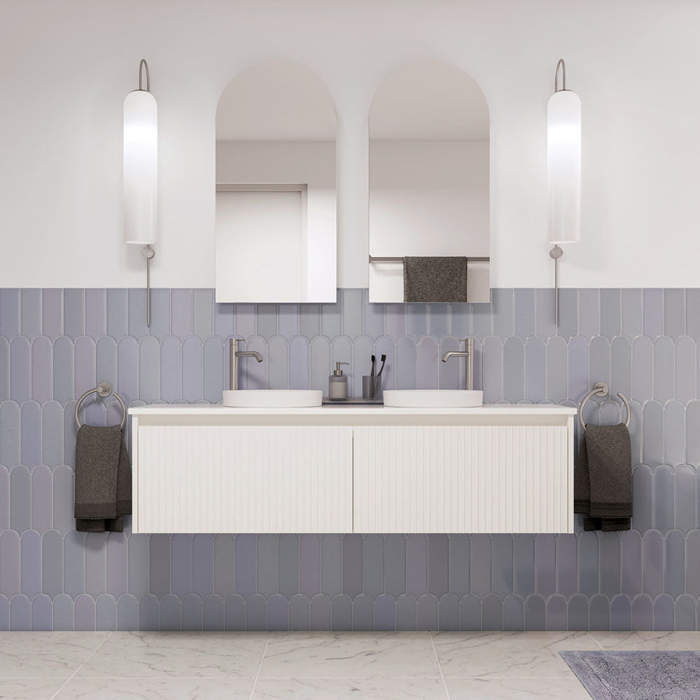 Wall-hung vanity with twin mirrors in a styled bathroom