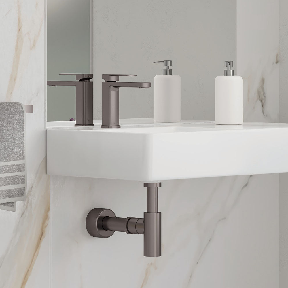 Fienza Tono gunmetal basin mixer installed beside a white basin