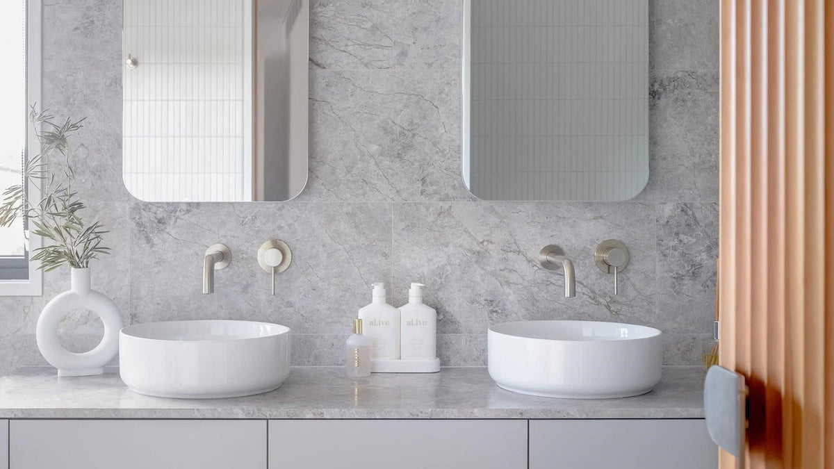Wall-mounted tapware above twin basins in a contemporary bathroom