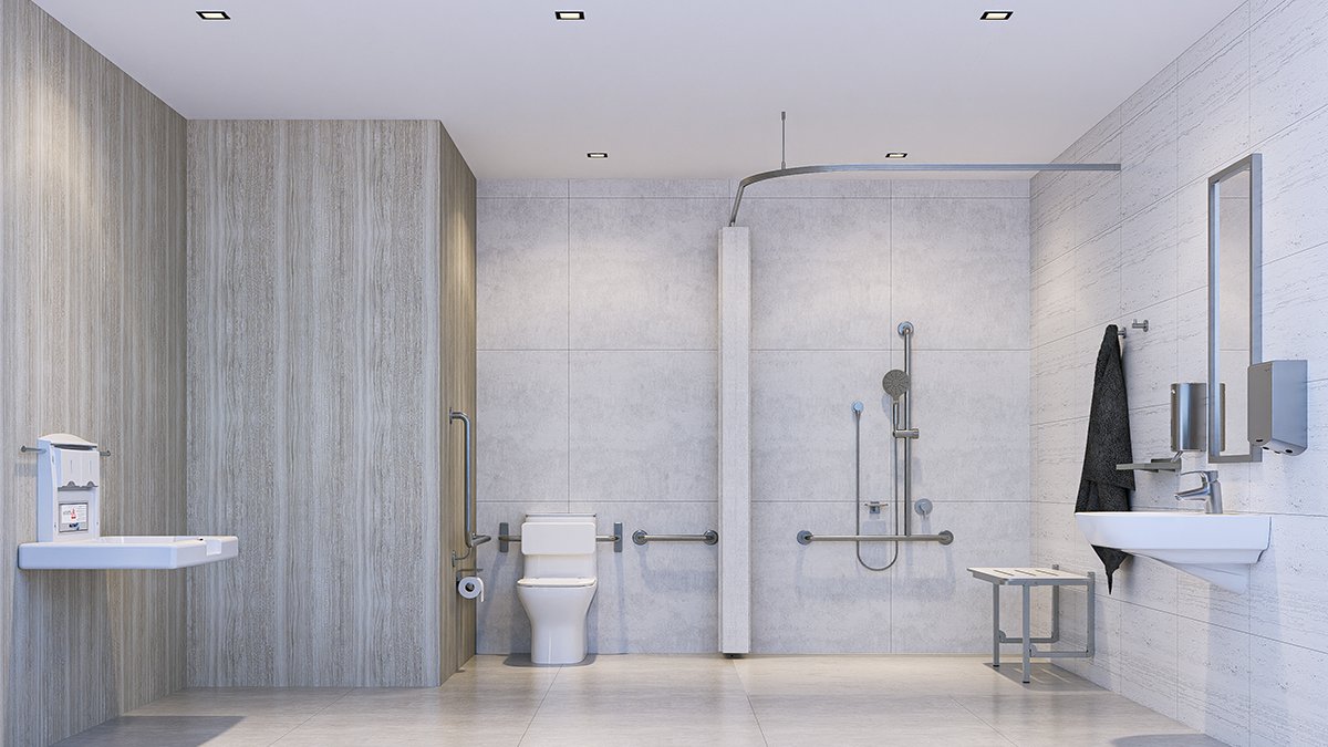 Accessible commercial bathroom with shower and support fittings
