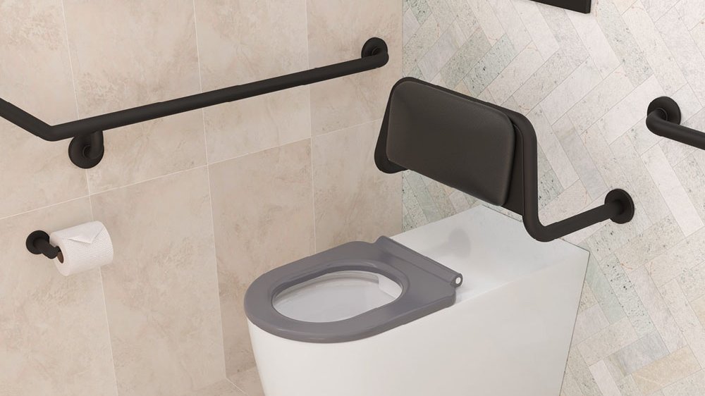 Accessible toilet with supporting grab rails installed