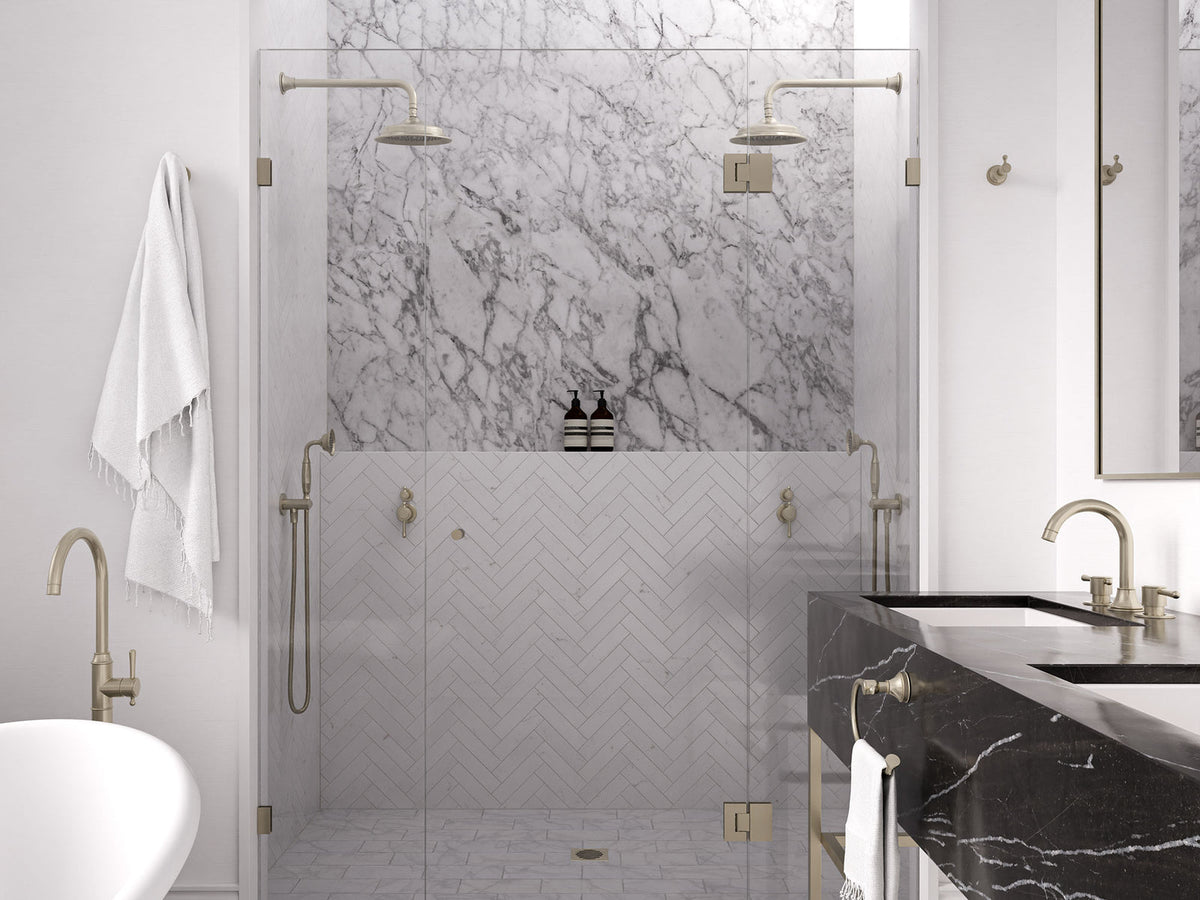 Meir Harrington tapware and showers in a marble bathroom