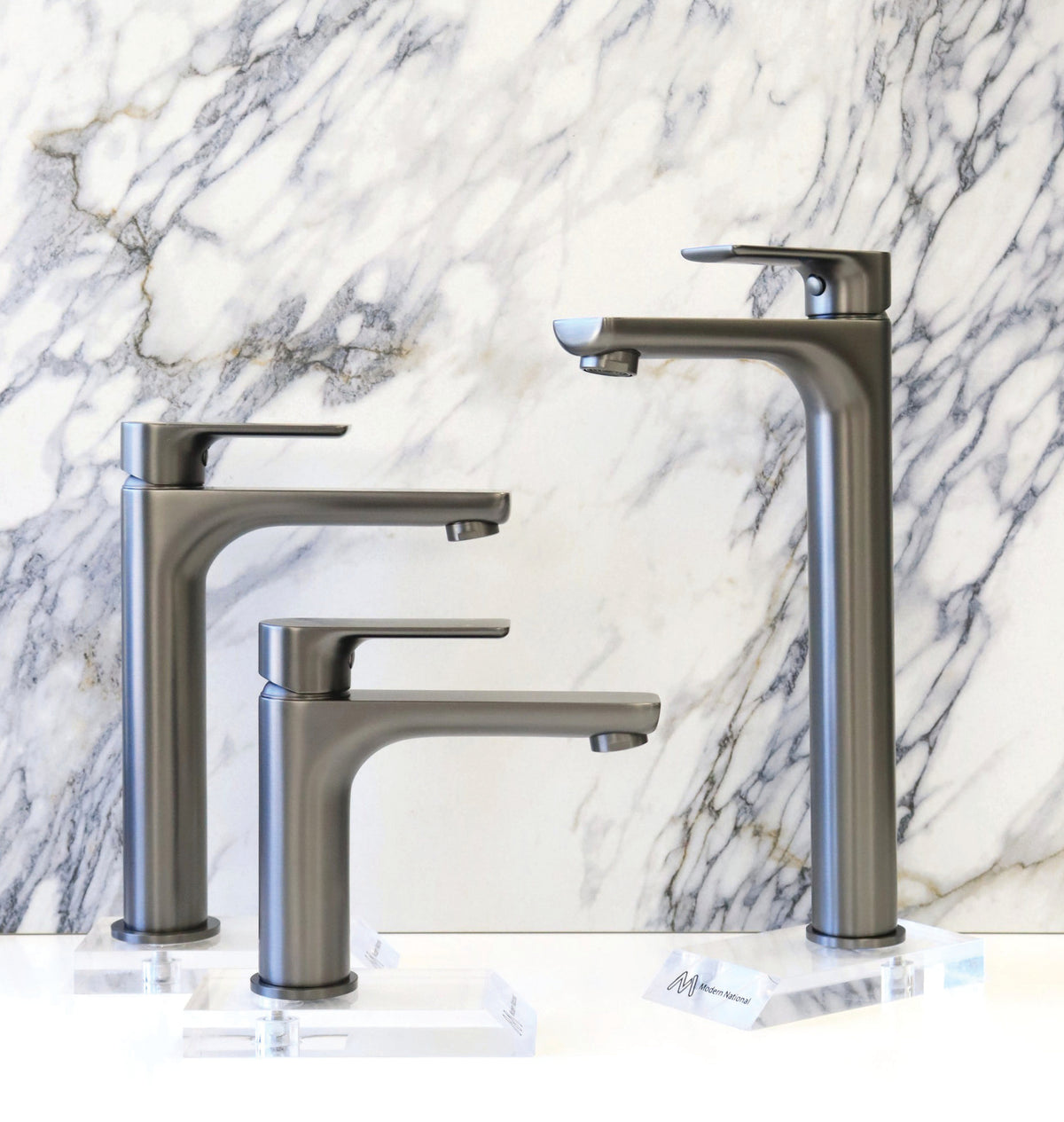 Modern National Nova basin mixers against a marble backdrop